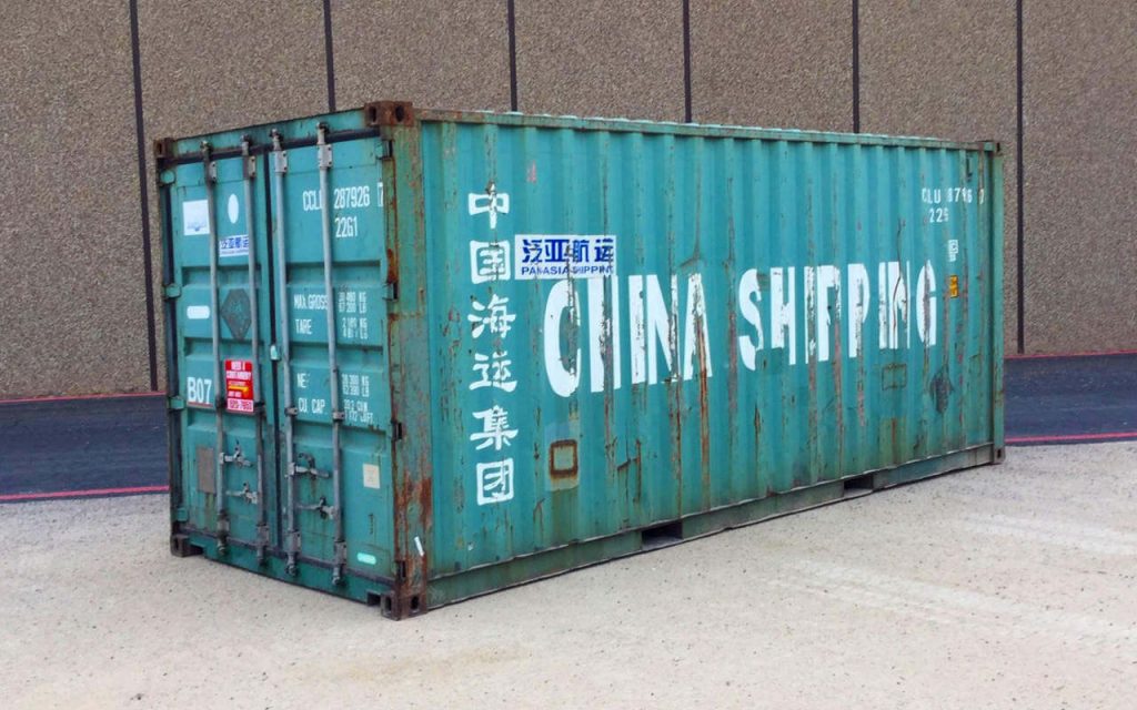 Green shipping container with Chinese text.