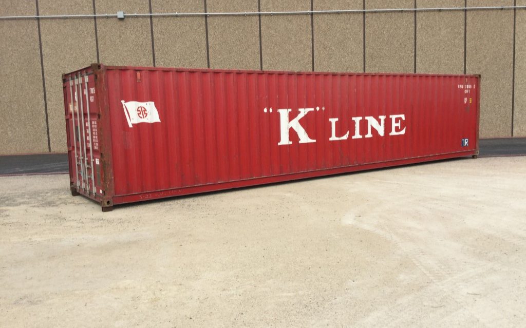 Red shipping container labeled "K" Line.