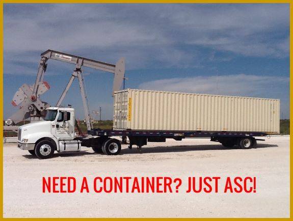 Truck with shipping container and crane.